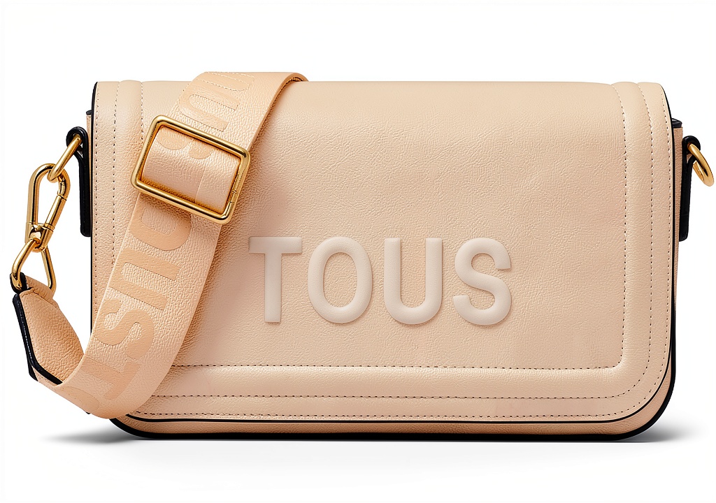 Tous Handtasche aus Polyurethan in Beige auf einem Tisch